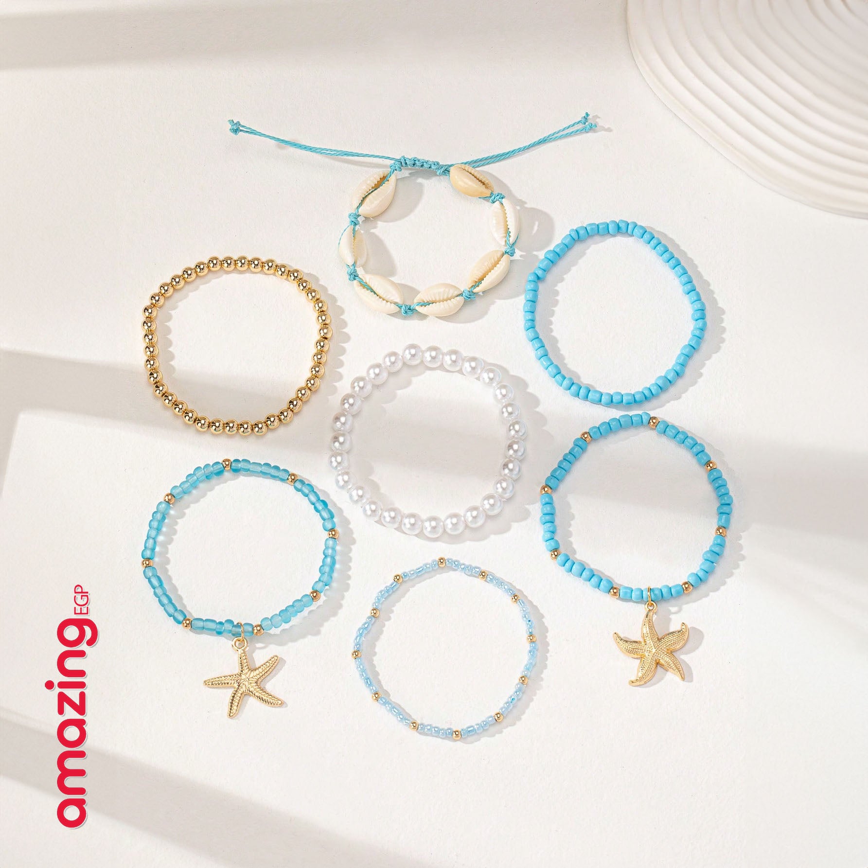 مجموعة أساور نسائية بوهيمية – أصداف ونجمات بتصميم صيفي عصري - (7 قطع)