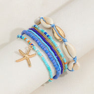 طقم أساور بوهيمي – خرز أزرق مع صدف وتعليقة نجمة بحر، لمسة صيفية جذّابة - 7 قطع - AMZ6111