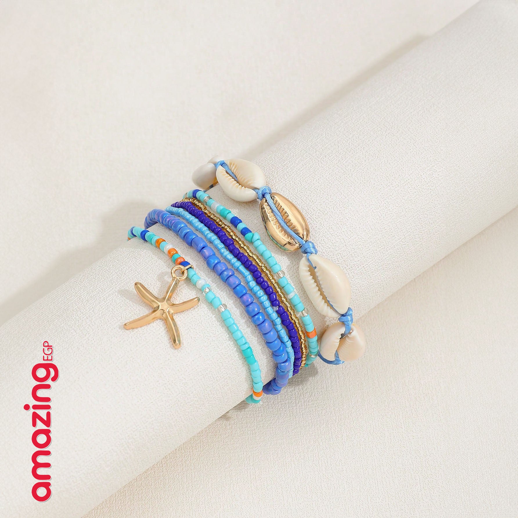 طقم أساور بوهيمي – خرز أزرق مع صدف وتعليقة نجمة بحر، لمسة صيفية جذّابة - 7 قطع - AMZ6111