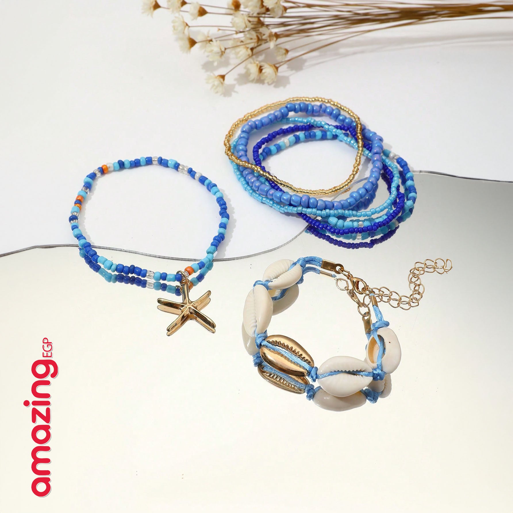 طقم أساور بوهيمي – خرز أزرق مع صدف وتعليقة نجمة بحر، لمسة صيفية جذّابة - 7 قطع - AMZ6111