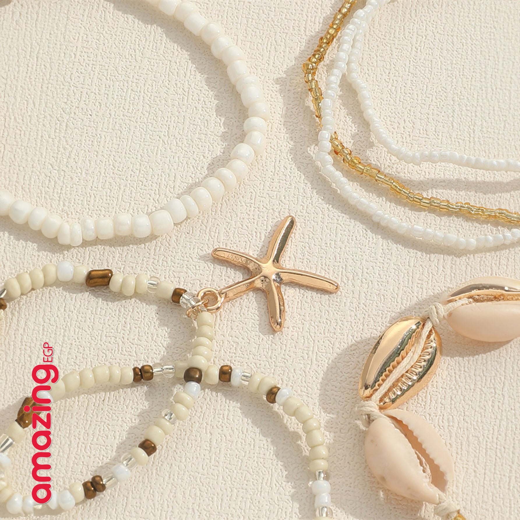 طقم أساور بوهيمي – خرز أزرق مع صدف وتعليقة نجمة بحر، لمسة صيفية جذّابة - 7 قطع - AMZ8661