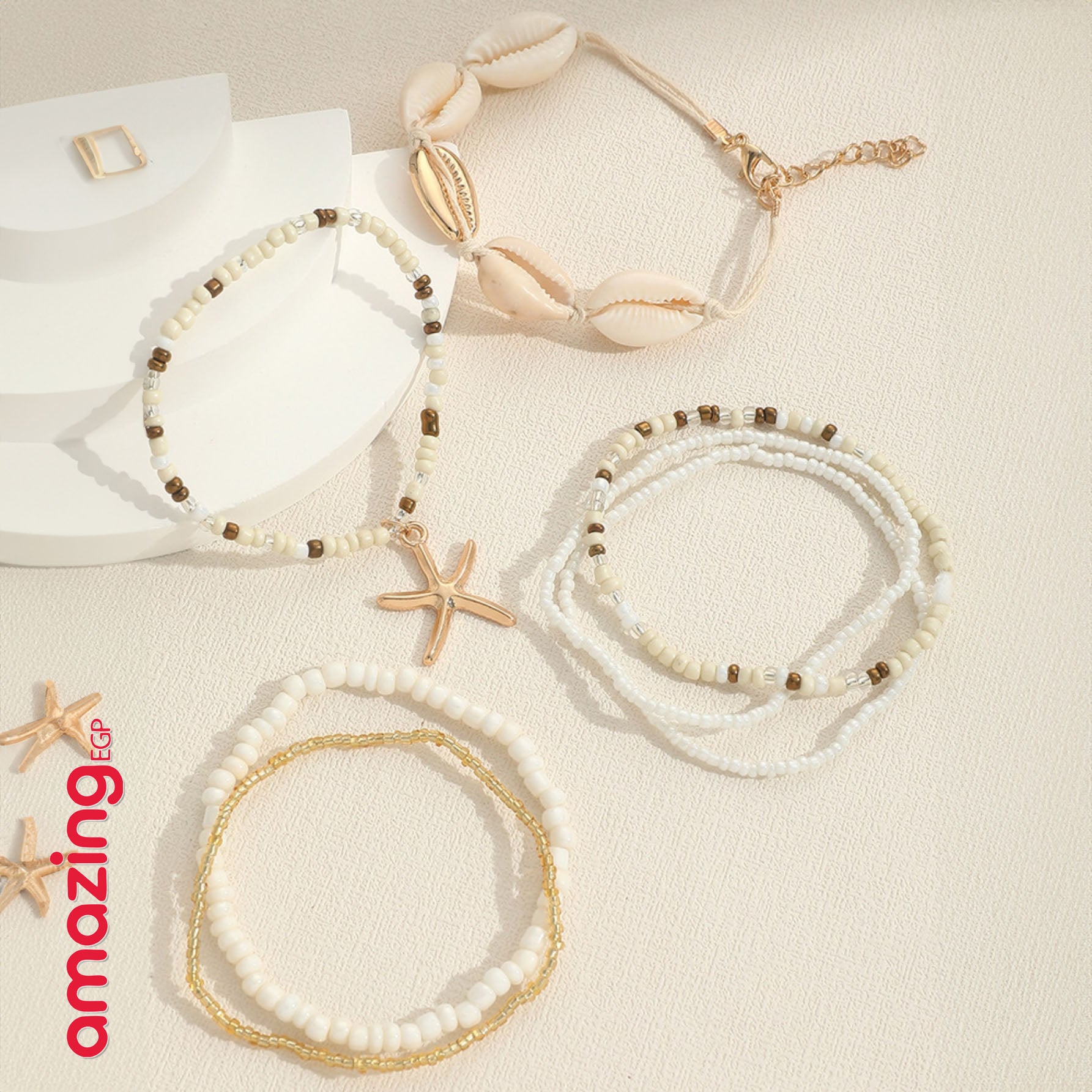 طقم أساور بوهيمي – خرز أزرق مع صدف وتعليقة نجمة بحر، لمسة صيفية جذّابة - 7 قطع - AMZ8661
