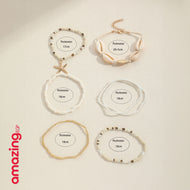 طقم أساور بوهيمي – خرز أزرق مع صدف وتعليقة نجمة بحر، لمسة صيفية جذّابة - 7 قطع - AMZ8661